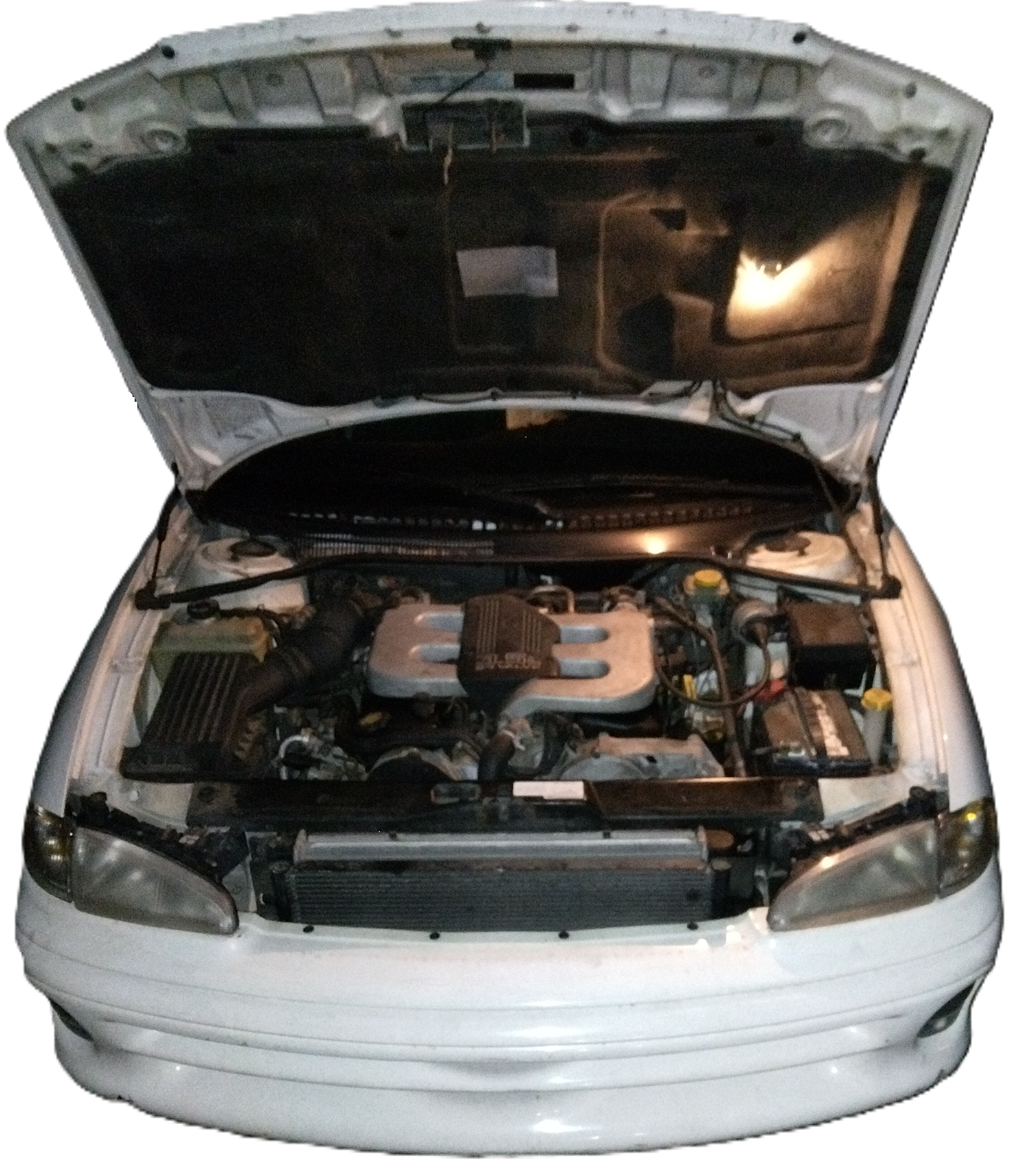 Mystique, a white 1996 Dodge Intrepid, with her hood popped and engine components exposed